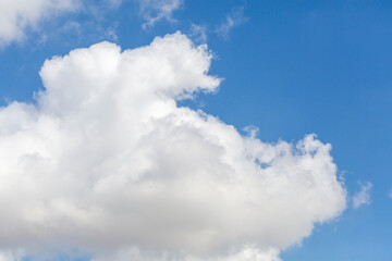 Naklejka na ściany i meble Dense white clouds in the blue sky in Turkey