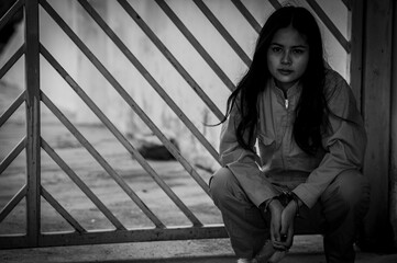 Portrait of women desperate to catch the iron prison,prisoner concept,thailand people,Hope to be...