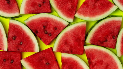 Sliced watermelon, on a yellow background, top view, summer background, wallpaper, horizontal, no people,