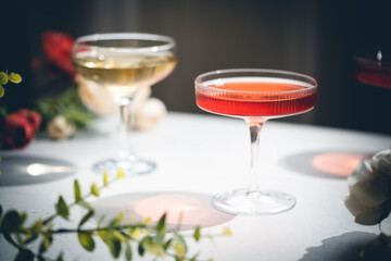 Sparkling wine or champagne glasses on white background with sharp shadows. Modern, stylish color concept