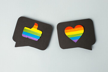 Happy Pride month banner for lgbt rights or social issues event. Colorful rainbow heart and thumb up in black social media interaction cloud, symbol for homosexual love, marriage, partnership sex