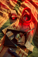 Drug addicts set, syringe, cigarettes and money