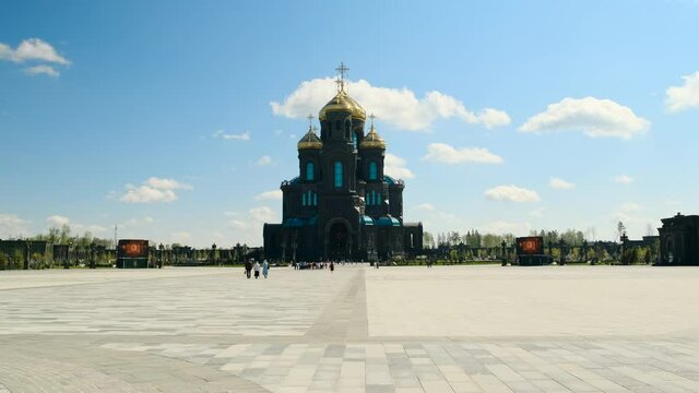 Kubinka, Russia - CIRCA 2021: Orthodox Church or tample in black color with golden domes, general form. smooth camera movement, faith in God and Christ. Cathedral in Park Patriot.