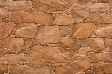 Fondo o textura de muro de piedra de color marron