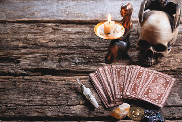 Tarot cards on the wooden table background. Future reading concept.