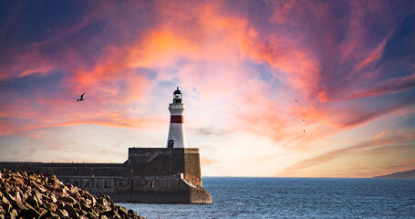 Sunrise at Freaerburgh  Lighthouse, Aberdeenshire, Scotland, UK.Fraserburgh Harbour is situated in...