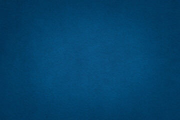 Blue color concrete wall texture background with vignette effect. Finely rough concrete  surface.