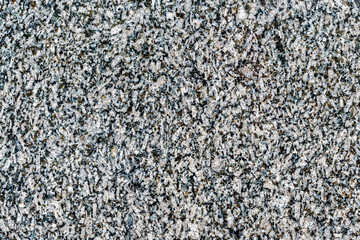 Natural black granite background. Day, horizontal shot front view.