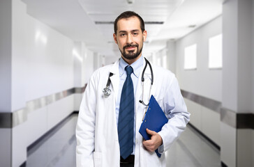 Handsome doctor portrait in a hispital hallway