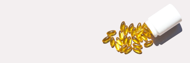 Omega3 gel capsule. Sun shadow. Yellow vitamin. Health eating. Dietology drug. Fish oil supplement. Nutritional concept. Golden softgel collagen. Medicine immunity cosmetics - obrazy, fototapety, plakaty