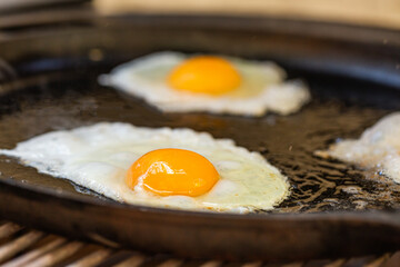 Fried egg on the grill. Close up