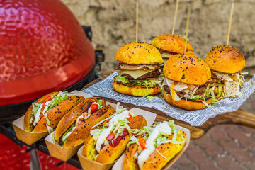 Big tasty beef burger full of fresh vegetable. Closeup. Fast food
