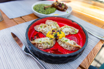 Fried Chinese gedza with mango mousse and chipotle pepper