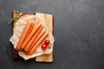 Vienna sausages. Top view with copy space for text. Black (dark) background.