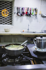 Vertical shot of a bowl of mushroom sauce in the kitchen