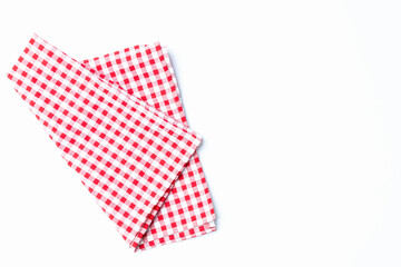 Top view napkin checkers red and white place on a white background. Fabric red and white Isolated with copy space.