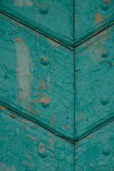 Old church wooden door. Metal rivets. Fragment. Vertical image.