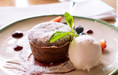 chocolate muffin dessert with ice cream in a cafe