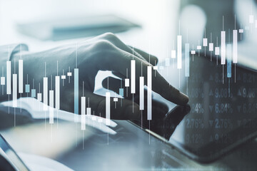 Abstract creative financial graph with finger clicks on a digital tablet on background, financial and trading concept. Multiexposure