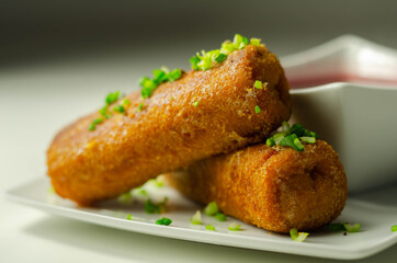 Delicious croquettes with sauerkraut and mushrooms served with hot red borscht