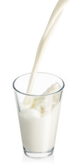 milk pouring into glass isolated on white