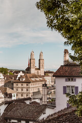 View of historic Zurich city center with famous Grossmunster Church from Lindenhof park, Zurich,...