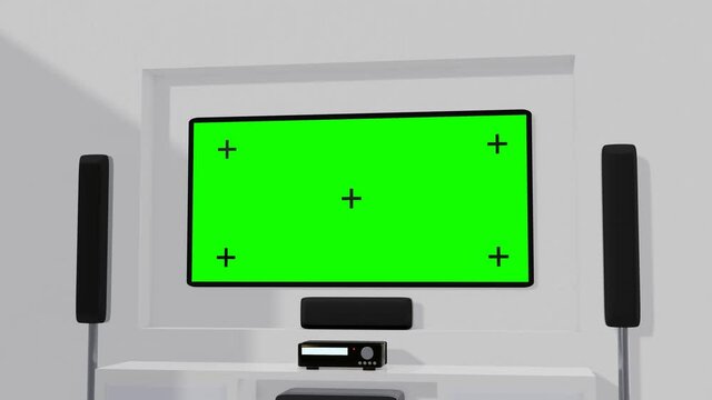 Green Screen on the home theater screen. A white wall-mounted smart TV and surround black speaker on the side. Bed Sofa or bench for watching TV in the living room
