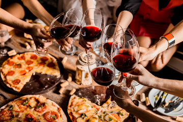 Group of Friends Women Female Hands Holding Wine Glasses and making a toast cheers