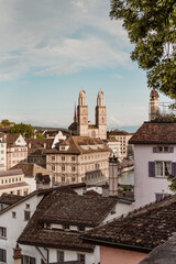 Fototapeta na wymiar View of historic Zurich city center with famous Grossmunster Church from Lindenhof park, Zurich, Switzerland