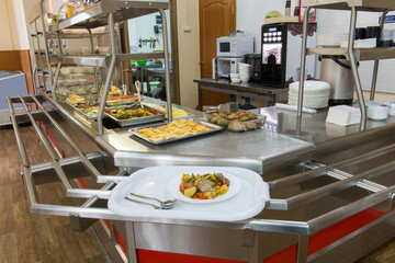 Self-service cafe. Serving table with food. 