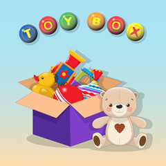 Decorative children's toys set in an open paper box on a sky blue background