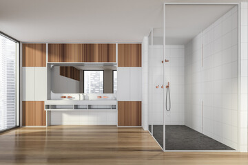 Modern design bathroom interior with glass shower cabin, double sink countertop, bronze faucets. Panoramic window with skyscrapers city view. Wooden parquet and white tiled walls.