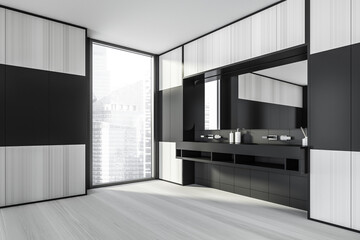 Modern design bathroom interior with double sink countertop, silver faucets, big mirror. Panoramic window with skyscrapers city view. Black tile walls. Public wc hands wash concept.
