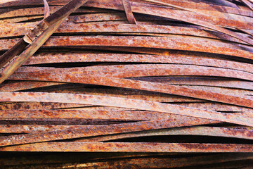 Abandoned rusting metal stripes in the open air