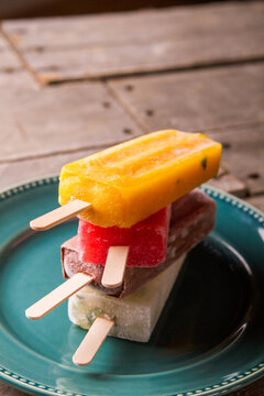 Variety of popsicles on a plate 