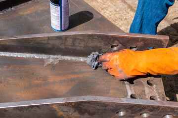 Step to use rag wipe Solvent Remover to cleaning the welded surface before performing spray Liquid...