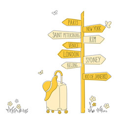 Yellow direction signpost with suitcase and hat. Travel concept.