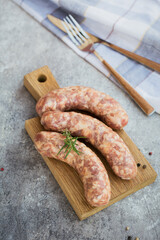 Raw homemade sausages with peppercorn and rosemary herb