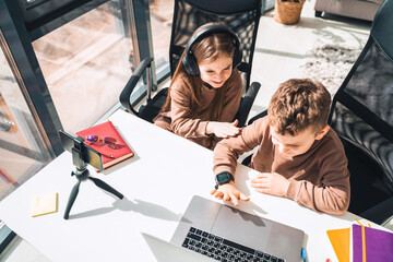 Boy and girl at laptop. Distance education