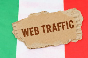 Against the background of the flag of Italy lies cardboard with the inscription - Web Traffic
