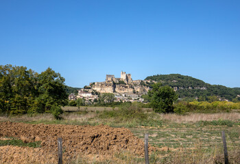  The medieval Chateau de Beynac rising on a limestone cliff above the Dordogne River. France,...