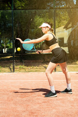 young woman playing padel