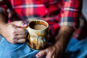Man holding a cup of coffee 