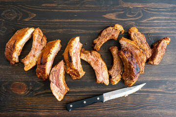 Barbecue Baby Back Ribs on a Wood Table: Pork  back ribs on a dark wood background