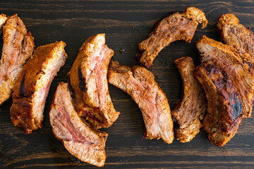 Barbecue Baby Back Ribs on a Wood Table: Pork  back ribs on a dark wood background