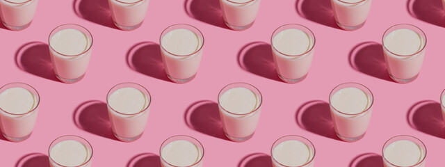 World Milk Day. Pattern on a  pink background. A glass of milk. Pattern. Banner