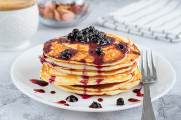 Delicious little pancakes topped with blueberry jam