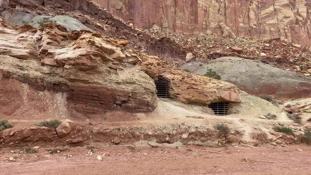 Panning shot of the closed-off Oyler Uranium Mine, located on Grand Wash Canyon Road in Capitol Reef National Park Utah
