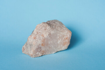 a piece of rock salt on a blue background