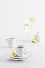 Minimalist white porcelain composition with lemons and avocado